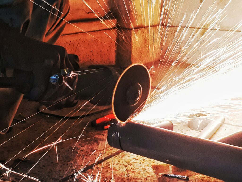 Angle grinder cutting steel