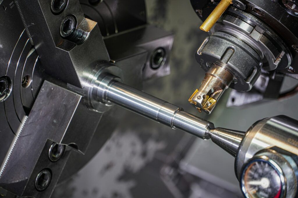 Steel bar being machined on a lathe