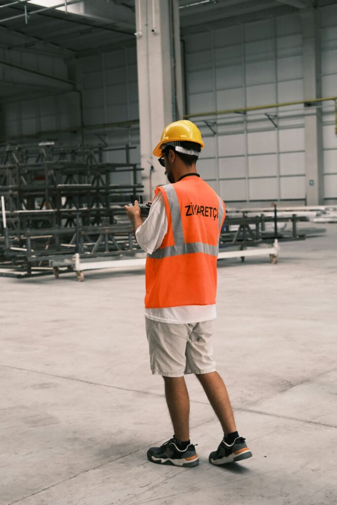 Engineer in a hard hat inspecting stock